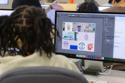 Student working on a moodboard in Adobe Illustrator