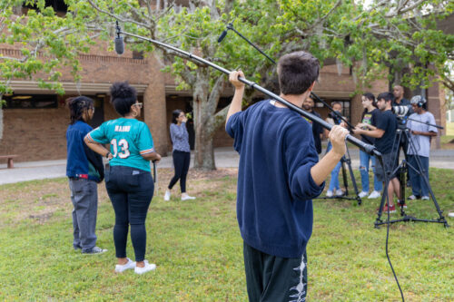 Students working a video production