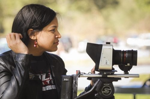 Ashley Bramwell studies a scene from behind a 4K Black Magic Cinema camera.