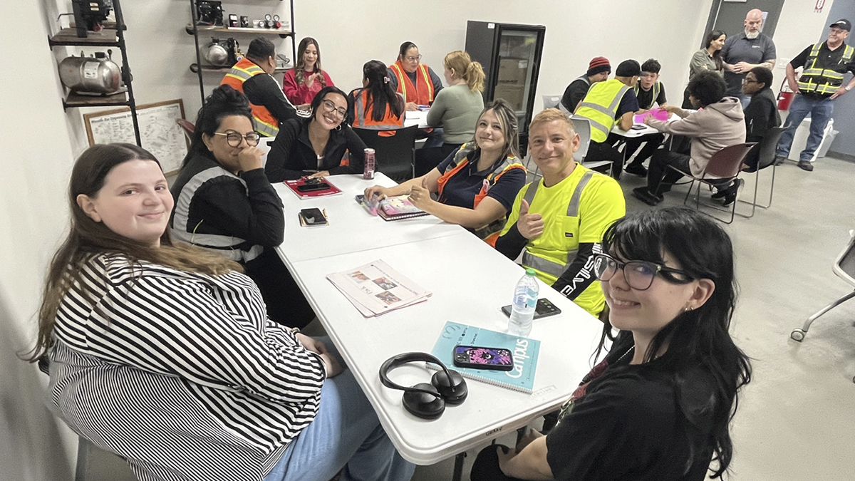 Polk State students help local factory employees improve English