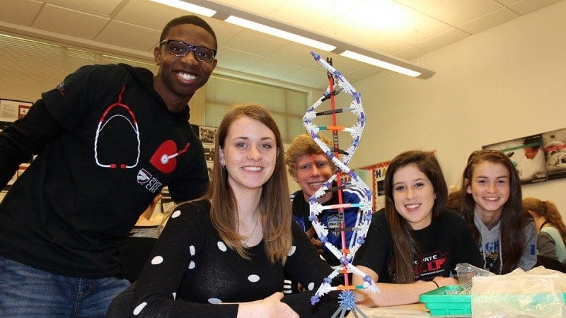 Polk State Chain of Lakes Collegiate senior Marcus Tarver (L) and junior Abby Miller (second from right) led Polk Pre-Collegiate Academy students (from left) Kayla Bird, Eric Newquist and Candace Rhoda in STEAM activities on Friday as part of the school's Robotics in Medicine workshops.