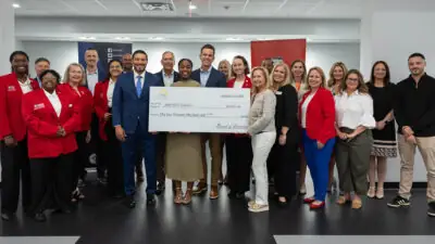 Group photo with check presentation