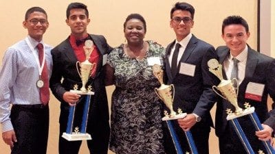 From left, Allen Oommen, Glen Abraham, FBLA adviser Patrice Thigpen, Sean Chauhan and Wade Weston.