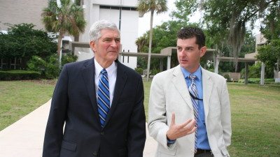 U.S. Rep. Daniel Webster (L) tours Polk State Winter Haven with student Ryan Darley.