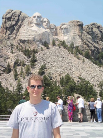 Jason Selfridge showed off his Polk State T-shirt at Mount Rushmore earlier this summer.