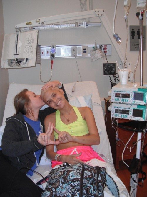 Sonja Wagner is shown here with her friend, Devon Callagy, during one of her many hospital stays. Wagner and Callagy will bike across the country this summer to raise money for the Ulman Cancer Fund. 