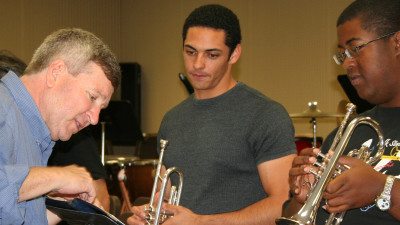 Polk State Music Professor Chris Sharp, left, has published hundreds of compositions.