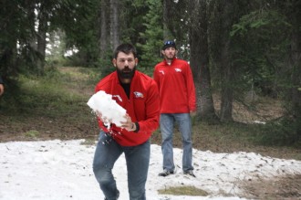 Chris Waltermire (RHP) lifts a giant snowball during the team's Sunday tour of Grand Mesa.