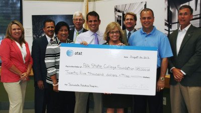 The Polk State Foundation on Monday recognized AT&T for a $25,000 grant that allowed more students to participate in Technobots, a summer robotics program. From left, Trustee Teresa Martinez, Polk State Foundation Treasurer Kevin Ashley, Trustee Chair Linda Pilkington, Trustee Dan Dorrell, AT&T Regional Director Matt Mucci, Polk State President Eileen Holden, and Trustees Mark G. Turner, Ricardo Garcia and Gregory Littleton.