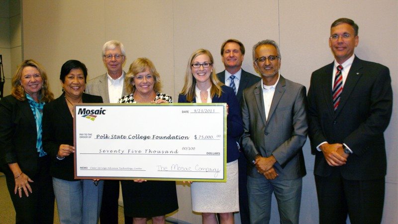 During Monday's District Board of Trustees meeting, the Polk State College Foundation recognized The Mosaic Company for its contribution of $75,000 to support the College's Clear Springs Advanced Technology Center. From left, Trustee Teresa Martinez, Trustee Chair Linda Pilkington, Trustee Vice Chair Dan Dorrell, Polk State President Eileen Holden, Mosaic Community Relations Manager Callie Neslund, Trustee Mark Turner, Polk State College Foundation Vice Chair Anu Saxena, and Trustee Greg Littleton.