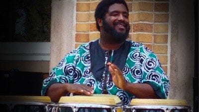 Percussionist Weedie Braimah entertains the audience outside the Polk State JD Alexander Center during a free concert Wednesday.