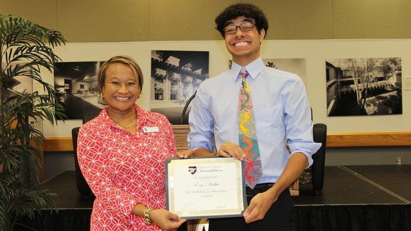 Polk State English Professor and ELITE Class VII Ambassador Orathai Northern presented the inaugural ELITE Legacy Scholarship to Eric Ardito during last week's ELITE Ambassadors Luncheon.