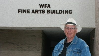 Norm Small, Polk's first theatre director, outside the Winter Haven Fine Arts Building. Small staged the first play in the Fine Arts Theatre, "Pippin," in the 1970s.