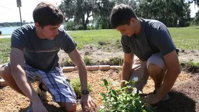 Students Andy Wooddell (L) and Frank Portlock were among two-dozen students who recently planted two rain gardens on Polk State's Winter Haven campus. The gardening project is one that will be highlighted in a Florida Campus Compact guide for service-learning and STEM education.