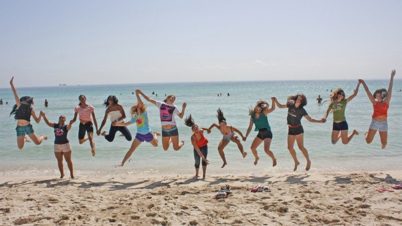 The Polk State College volleyball team shows its togetherness on Miami Beach before a tournament in September.