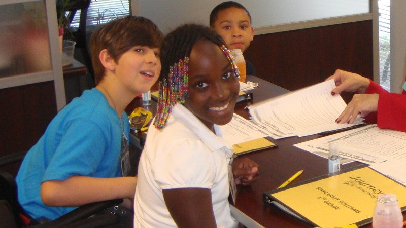 A partnership between Polk State Chain of Lakes Collegiate High School and the Winter Haven Housing Authority led to the creation of an after-school tutoring program. That program has now received recognition from the National Association of Housing and Redevelopment Officials. Pictured here are a handful of the children who have participated in the program.