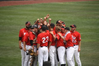 The Polk State Eagles huddle before taking the field against Western Nevada during the first round of the NJCAA JuCo World Series.