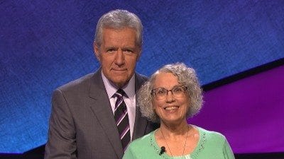 Retired Polk State professor Kathy Riley won $10,400 while competing on "Jeopardy!" earlier this month. She has donated $1,000 of her winnings to the Polk State College Foundation. Here, she is pictured with "Jeopardy!"