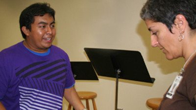 Polk State student Eric Ramirez, left, and adjunct instructor Ilene Fins practice the dance Ramirez will perform during the Polk State Lakeland Cabaret's performance, "Polk State...See? You and Me, Diversity Speakeasy."