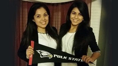 Vanessa Revelo (L) and Berenis Revelo are cousins who will both become the first in their families to graduate from college. They will receive their degrees during Polk State's Dec. 11 commencement ceremony.