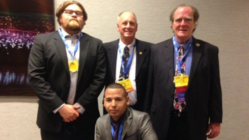 Polk State's Phi Beta Lambda chapter brought home several honors from the national conference. Front row, Hector Santa. Back row from left, Kyle Cox, adviser and Business Professor Herb Nold and Jim Harmon.