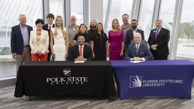 Presidents, Board members and other representatives posing for a group photo.