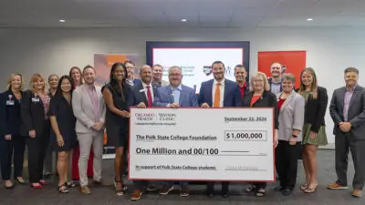 Polk State and Orlando Health teams with check presentation