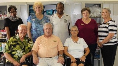 Hope Presbyterian Church has pledged $10,000 to My Brother's Keeper, an initiative at Polk State Winter Haven to help needy students. Pictured here inside My Brother's Keeper are, back row from left, Polk State Coordinator of Veteran Services Carole Toney, Church Deacon Mardy Castro, My Brother's Keeper Student Supervisor Casmore Shaw, Church Elders Carolyn Hayes and Barb Follett; front row from left, Church Chancel Choir President Ron Hatley, Pastor Owen Carriker, and Church Deacon Sue Williams.