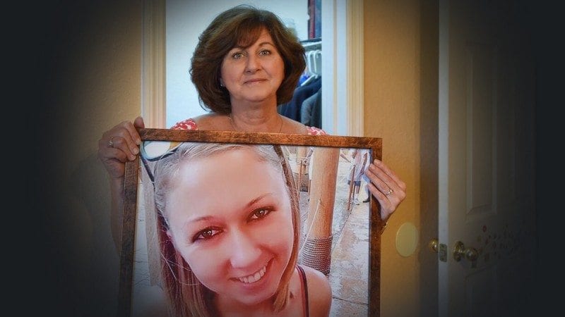 Janice Honiker holds a photo of her daughter, Michelle, who died earlier this year of a drug overdose. Janice has started a nonprofit called Michelle's Closet, which helps women in drug treatment. Janice graduates from Polk State with her Bachelor of Applied Science in Supervision and Management on Dec. 17.