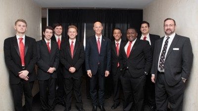 Polk State's Jazz Society performed during Polk County Day last week in Tallahassee. From left, Ian Albritton, Brendan Nagy, Trenton Moser, Luke Wilmoth, Gov. Rick Scott, Alex Irizarry, Joseph Lewis, Clement Dutheil, and Director of Bands Donald West.