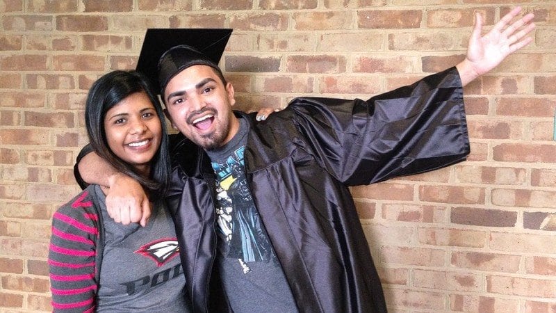 Emilio Roman will participate in Polk State's 113th graduation thanks to Sasha Syboodeen, who is letting him borrow her cap and gown.