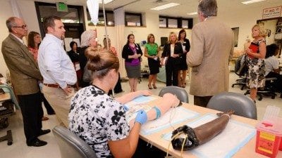 Attendees of Polk State College's Legislative Tour learn about the Nursing program during their tour of the Lakeland campus on Wednesday.