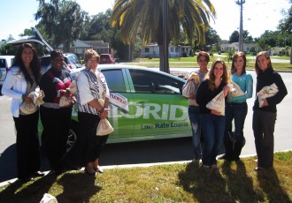 Polk State Chain of Lakes Collegiate High School's Leadership Cadre recently raised $947 for good causes through its Penny Harvest. From left are Jeanette Wallace and Bridget Dewdney from MIDFLORIDA, Polk State Chain of Lakes Director Bridget Fetter, students Laci Jackson, Michelle Luckett, Hailey Stinchcomb, Polk State Chain of Lakes student project chairs, and Polk State Service Learning Coordinator Sarah Hoiland.