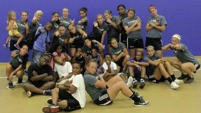 Polk State soccer players pose with kids for whom they put on a soccer clinic at the Boys and Girls Clubs of the Gulf Coast in Gulfport, Miss..