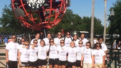 Volunteers from the Eagles soccer team pose for a photo before volunteering with Special Olympics.